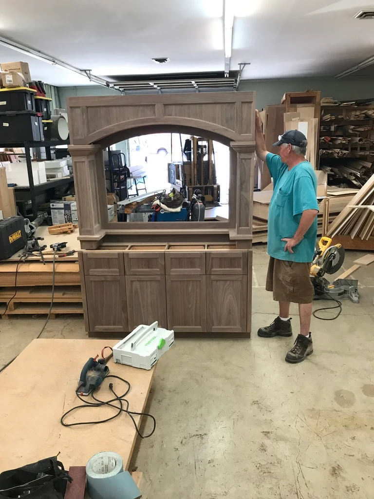 Inside the Arbuckle workshop, with a large unfinished cabinetry piece